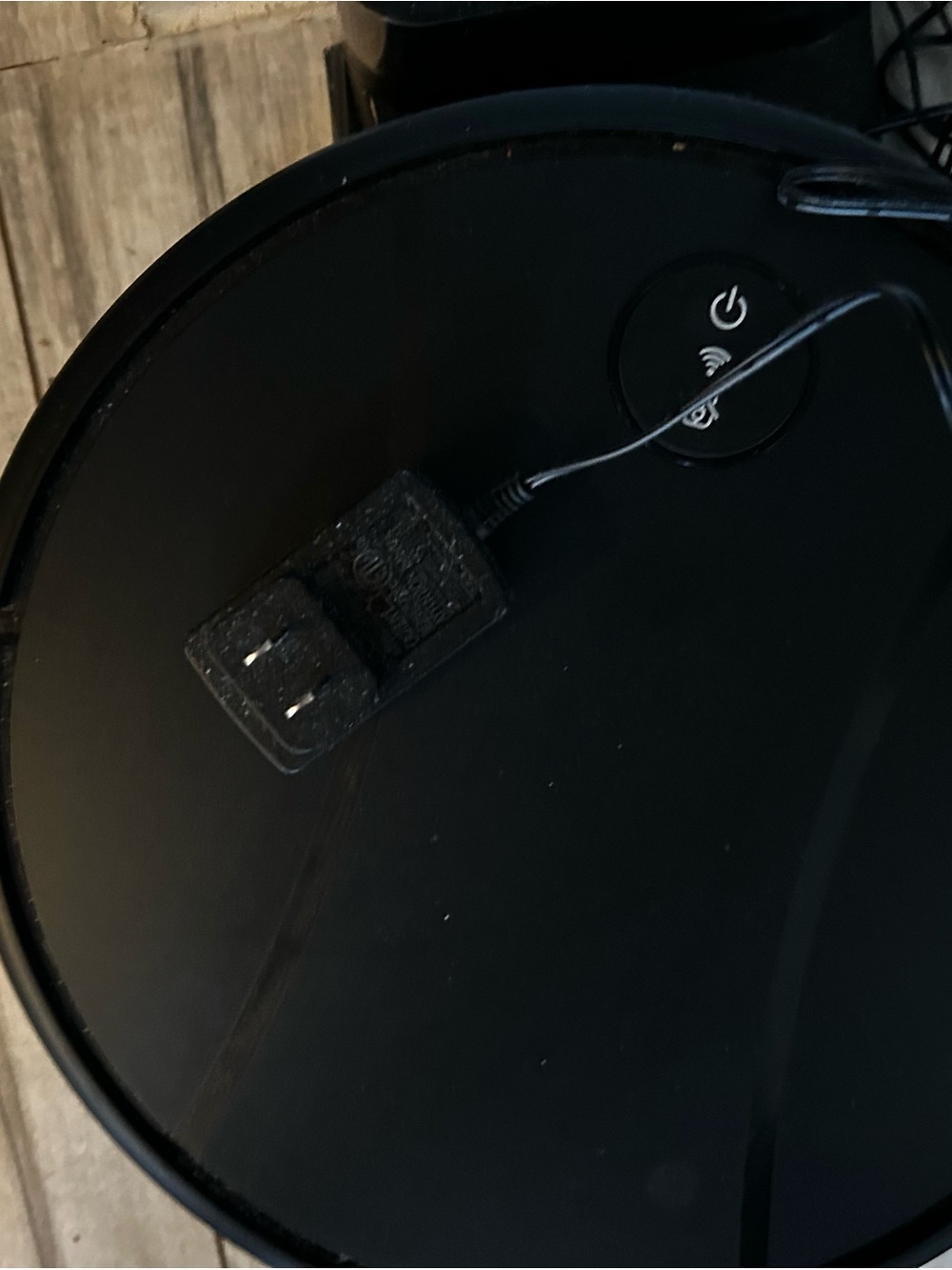 Black Round vacuum and floor washer Device with Power Button and Adapter
